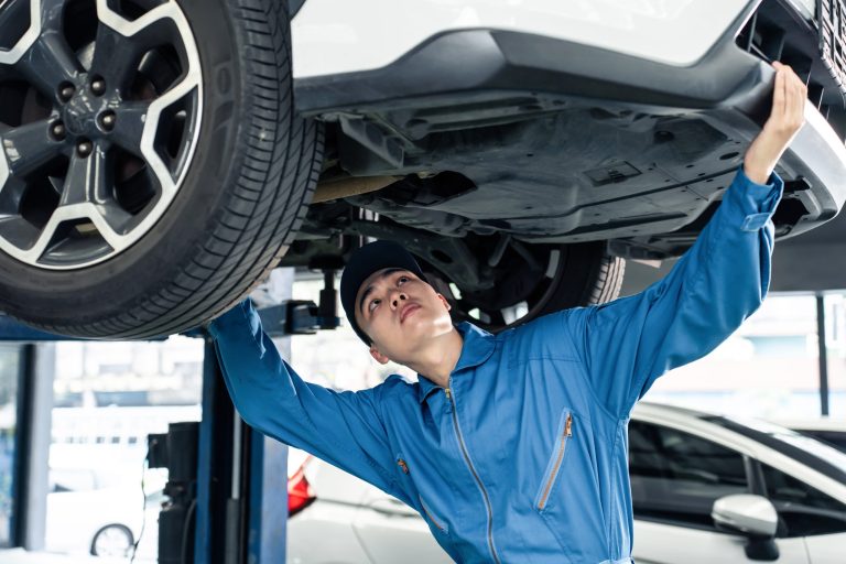 asian-automotive-mechanic-repairman-look-under-car-2026-01-09-08-27-13-utc-scaled-4