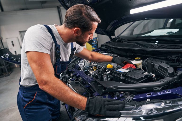 car-mechanic-inspecting-the-engine-in-auto-repair-2026-01-08-21-47-37-utc-2
