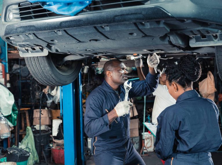 mechanics-inspecting-car-on-lift-in-auto-repair-sh-2026-01-06-10-39-31-utc-1